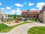 Drohnenbild Spielplatz - Erstbezug – Modernes Wohnen im historischen Ambiente (P3)