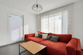 Wohnzimmer - Modernes Familienglück in ruhiger Lage – energieeffizientes Einfamilienhaus mit Garten, Smart Home und Doppelgarage