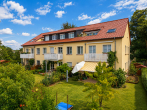 Hausansicht - Wohnen zwischen Stadt und Natur – großzügige Dachgeschosswohnung in Heide-Süd